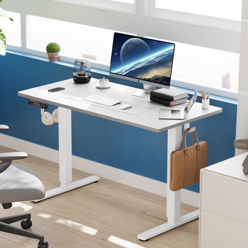 “Fully assembled Jakyb standing and height-adjustable desk in a modern home office setup.”